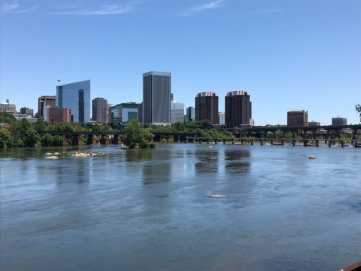 A historic, cobblestone street in a European capital city.